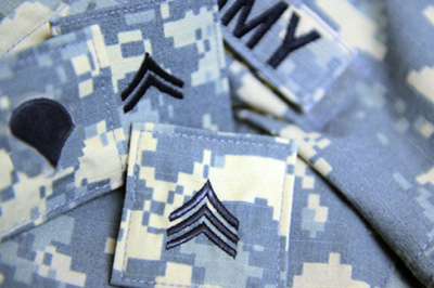 Several junior Army rank insignia.