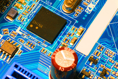 A circuit board features a microchip emblazoned with the word "China."